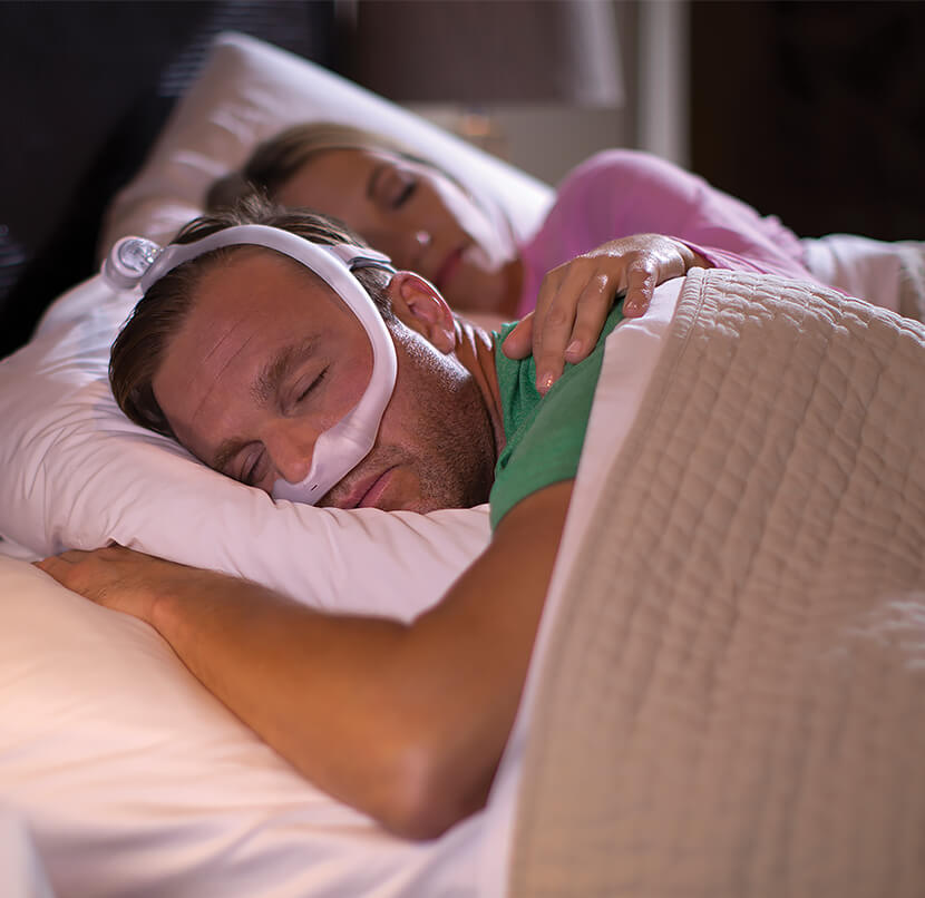 Male using Nasal CPAP Dreamwear mask when going to bed